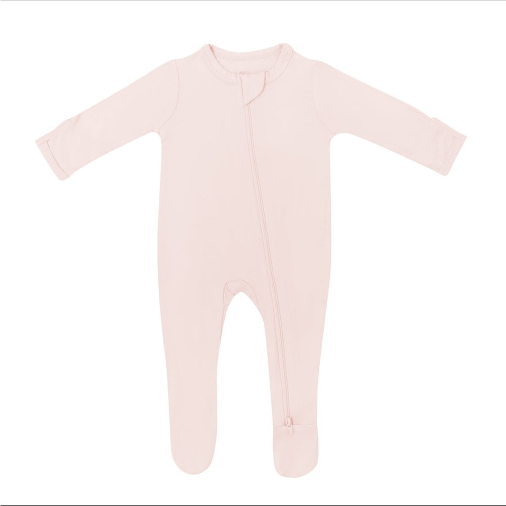 Kyte Baby footed zippered onesie in blush pink.